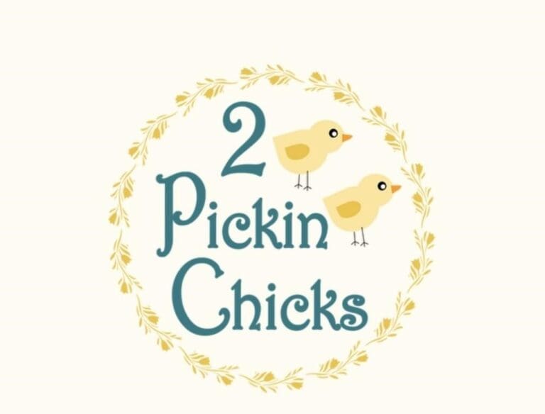 Pickin Chicks logo for Heartland Auction Group, featuring two cute chicks in a circular design.